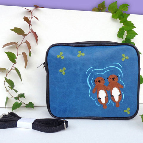 LAVISHY fun & playful applique vegan leather cross body bag/toiletry bag with adorable sea otter lovers applique. It's Eco-friendly, ethically made, cruelty free. A great gift for you or your friends & family. Wholesale available at www.lavishy.com with many unique & fun fashion accessories.