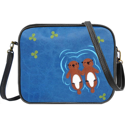 LAVISHY fun & playful applique vegan leather cross body bag/toiletry bag with adorable sea otter lovers applique. It's Eco-friendly, ethically made, cruelty free. A great gift for you or your friends & family. Wholesale available at www.lavishy.com with many unique & fun fashion accessories.