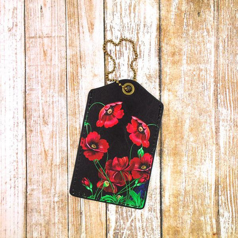 Mlavi vegan leather luggage tag for women with Ukrainian poppy flower print. Great for everyday use & a unique gift for yourself & family & friends. More Ukraine themed bags, wallets & other fashion accessories are available for wholesale at www.mlavi.com for gift shop & boutique buyers worldwide.