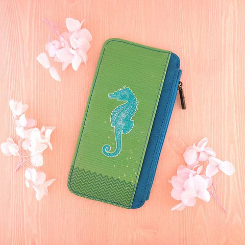 Eco-friendly, cruelty-free, ethically made seahorse print vegan cardholder by Mlavi Studio. Great for travel or as gift for family & friends. Wholesale at www.mlavi.com to gift shop, clothing & fashion accessories boutiques, book stores.