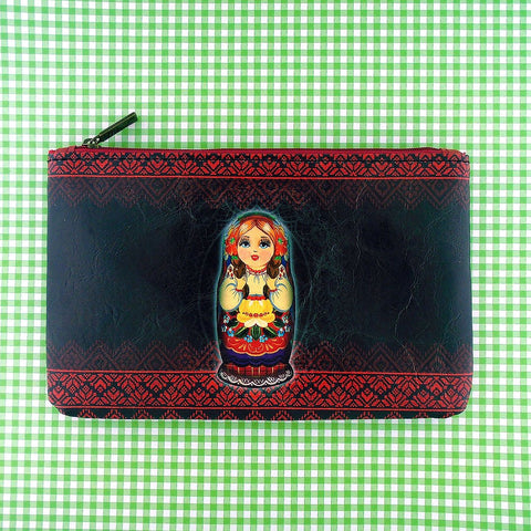Mlavi vegan leather medium flat/makeup pouch for women with Nesting doll Ukrainian girl print. Great for everyday use & a unique gift for yourself & family & friends. More Ukraine themed bags, wallets & other fashion accessories are available for wholesale at www.mlavi.com for gift & boutique buyers worldwide.