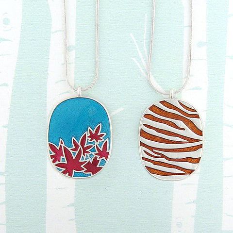 101-026: Enamel Maple Leaf & Animal Print Reversible Necklace