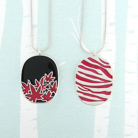 101-026: Enamel Maple Leaf & Animal Print Reversible Necklace