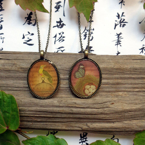 LAVISHY vintage style handmade reversible pendant necklace with bird & butterfly print. Great gift for friends & family. Wholesale at www.lavishy.com