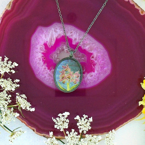 LAVISHY vintage style handmade reversible pendant necklace with bird & orchid flowers print. Great gift for friends & family. Wholesale at www.lavishy.com