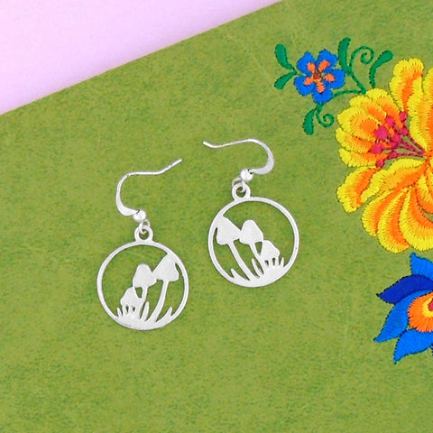 Online shopping for LAVISHY silver plated cutout mushroom pendant earrings- a symbol of good luck and good fortune. Wholesale available at www.lavishy.com to gift shops, fashion accessories and clothing boutiques in Canada, USA and worldwide.