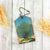 Mlavi's vegan leather vintage style luggage tag features whimsical peacock illustration. A great gift idea for yourself & your friends & family. More whimsical fashion accessories are available for wholesale at www.mlavi.com for gift shop,  , fashion accessories & clothing boutique buyers in Canada, USA & worldwide.