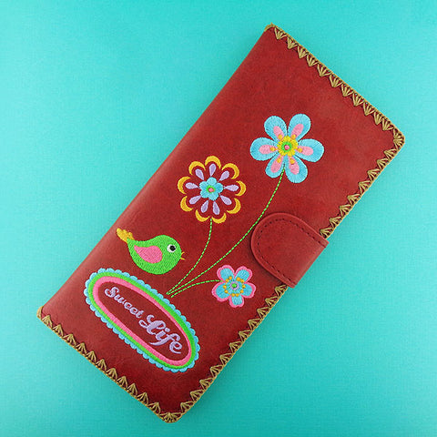 Online shopping for vegan brand LAVISHY's Eco-friendly, ethically made, cruelty free embroidered large flat wallet for women features sweet life flower & bird embroidery motif. Wholesale at www.lavishy.com for retailers like gift shop, clothing & fashion accessories boutique & book store worldwide since 2001.