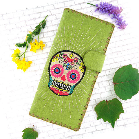Online shopping for vegan brand LAVISHY's Eco-friendly, ethically made, cruelty free embroidered large flat wallet for women features Mexican day of the dead sugar skull inspired skull embroidery motif. Wholesale at www.lavishy.com for gift shop, clothing & fashion accessories boutique & book store worldwide since 2001.