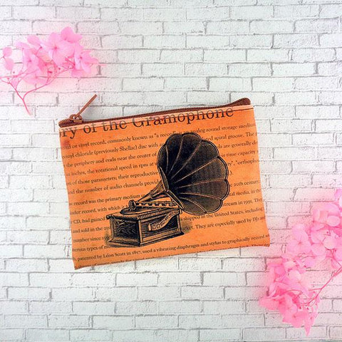 Online shopping for vegan brand LAVISHY's cool vegan coin purse with vintage/retro style print of gramophone illustration on the background of text about the history of gramophone. It's great for everyday use or as gift for friends & family. Wholesale at www.lavishy.com to gift shop, boutique & book store in USA, Canada & worldwide since 2001.