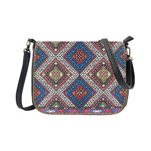 Mlavi Studio's whimsical vegan crossbody bag with Bohemian style Balkan textile pattern print. It's roomy enough to hold wallet, smart phone and small personal items like key and lip balm. Wholesale at www.mlavi.com for gift shops, fashion accessories & clothing boutiques, museum stores worldwide.