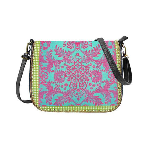 Mlavi Studio's whimsical vegan crossbody bag with Mexican oilcloth flora pattern print. It's roomy enough to hold wallet, smart phone and small personal items like key and lip balm. Wholesale at www.mlavi.com for gift shops, fashion accessories & clothing boutiques, museum stores worldwide.