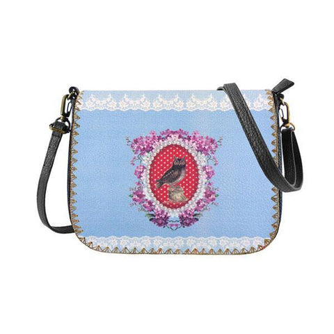 Mlavi studio's kitsch style  owl & flower print vegan crossbody bag made with SGS tested cruelty-free Eco-friendly cruelty free vegan materials. Wholesale available at www.mlavi.com for gift shop, fashion accessories & clothing boutique in Canada, USA & worldwide.
