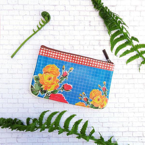 Mlavi beautiful Mexican oilcloth floral pattern print small pouch/coin purse made with Eco-friendly & cruelty free vegan materials.  Great for every use or as gift for family & friends. Wholesale at www.mlavi.com for gift shops, clothing & fashion accessories boutiques worldwide.