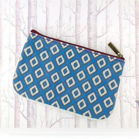 Mlavi Ikat pattern print small pouch/coin purse made with Eco-friendly & cruelty free vegan materials. Great for everyday use & wonderful as a gift to family & friends. Wholesale at www.mlavi.com for gift shops, fashion accessories & clothing boutiques, museum stores worldwide.