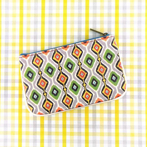 Mlavi Ikat pattern print small pouch/coin purse made with Eco-friendly & cruelty free vegan materials. Great for everyday use & wonderful as a gift to family & friends. Wholesale at www.mlavi.com for gift shops, fashion accessories & clothing boutiques, museum stores worldwide.