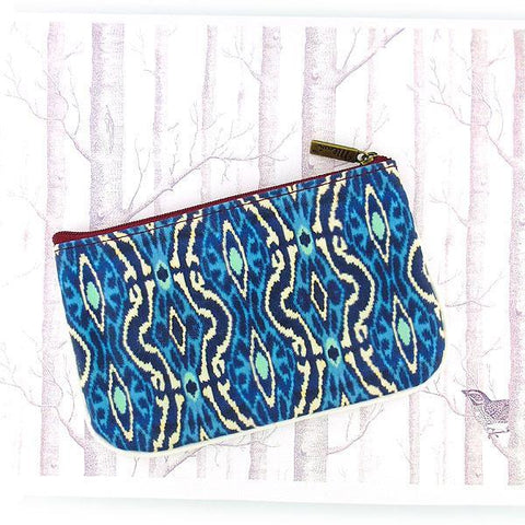 Mlavi Ikat pattern print small pouch/coin purse made with Eco-friendly & cruelty free vegan materials. Great for everyday use & wonderful as a gift to family & friends. Wholesale at www.mlavi.com for gift shops, fashion accessories & clothing boutiques, museum stores worldwide.