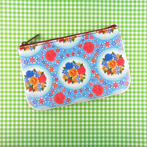 Mlavi Eco-friendly, cruelty-free, ethically made vegan/faux leather small pouch/coin purse features colorful Mexican oilcloth garden flora pattern. Great for every use or as gift for family & friends. Wholesale at www.mlavi.com for gift shops, clothing & fashion accessories boutiques worldwide.