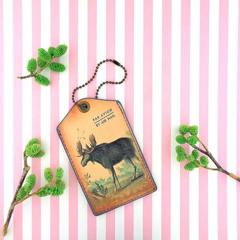 Eco-friendly, cruelty-free, ethically made moose print vegan luggage tag by Mlavi Studio. Great for travel or as gift for family & friends. Wholesale at www.mlavi.com to gift shop, clothing & fashion accessories boutiques, book stores.