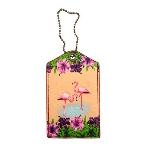 Mlavi vegan leather vintage style luggage tag features whimsical flamingo & hibiscus flower illustration. A great gift idea for yourself & your friends & family. More whimsical fashion accessories are available for wholesale at www.mlavi.com for gift shop,  , fashion accessories & clothing boutique buyers in Canada, USA & worldwide.