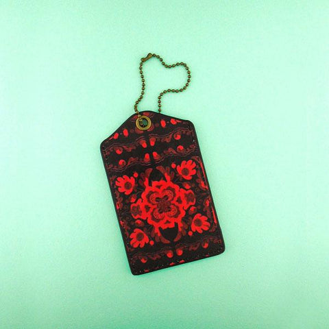Mlavi vegan leather luggage tag for women with Ukrainian poppy flower embroidery pattern print. Great for everyday use & a unique gift for yourself & family & friends. More Ukraine themed bags, wallets & other fashion accessories are available for wholesale at www.mlavi.com for gift shop & boutique buyers worldwide.