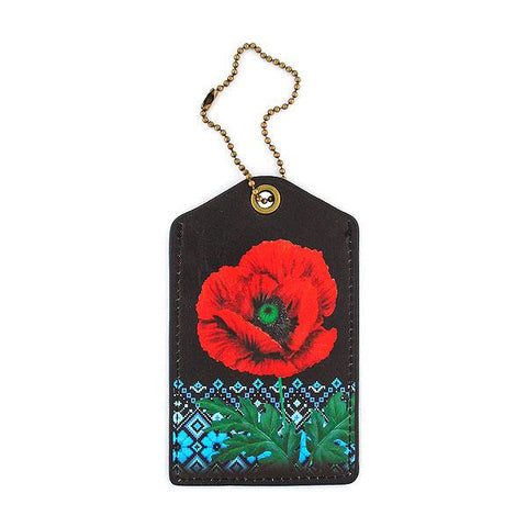 Mlavi vegan leather luggage tag for women with Ukrainian poppy flower & embroidery pattern print. Great for everyday use & a unique gift for yourself & family & friends. More Ukraine themed bags, wallets & other fashion accessories are available for wholesale at www.mlavi.com for gift shop & boutique buyers worldwide.