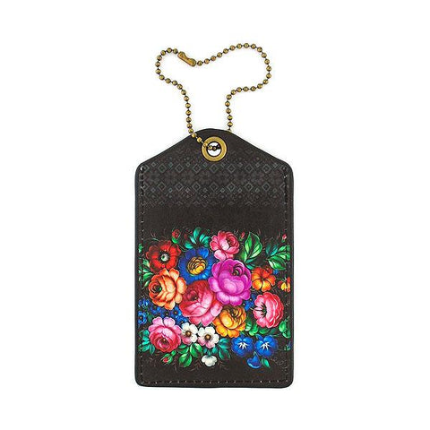 Mlavi vegan leather luggage tag for women with Ukrainian flower print. Great for everyday use & a unique gift for yourself & family & friends. More Ukraine themed bags, wallets & other fashion accessories are available for wholesale at www.mlavi.com for gift shop & boutique buyers worldwide.