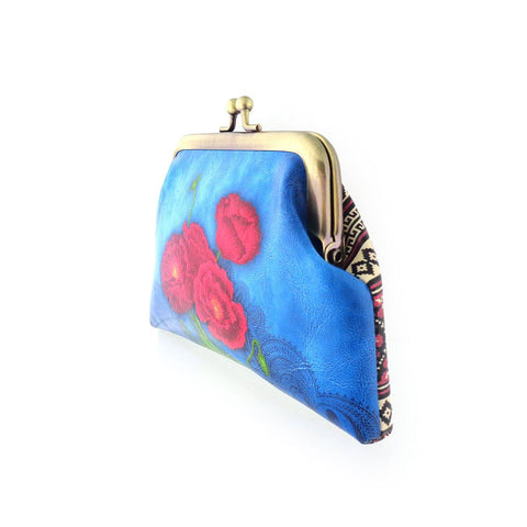 Mlavi's Ukrainian embroidery pattern & poppy flower print kiss lock frame vegan leather coin purse. Great for everyday use & a unique gift for yourself & family & friends. More Ukraine themed bags, wallets & other fashion accessories are available for wholesale at www.mlavi.com for gift & boutique buyers worldwide.