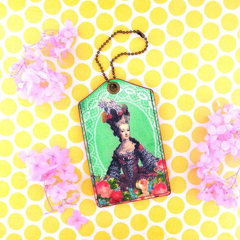 Eco-friendly, cruelty-free, ethically made luggage tag with vintage style queen Marie Antoinette print by Mlavi Studio. Great for everyday use, travel or as whimsical gift for family & friends. Wholesale at www.mlavi.com to gift shop, clothing & fashion accessories boutiques, book stores worldwide.