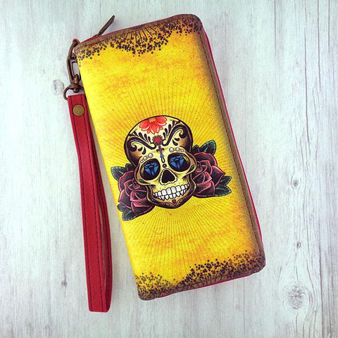 Eco-friendly, cruelty-free, ethically made large wristlet wallet with Tattoo style sugar skull print by Mlavi. Great for everyday use, travel or as gift for family & friends. Wholesale at www.mlavi.com to gift shop, clothing & fashion accessories boutiques, book stores in Canada, USA & worldwide.