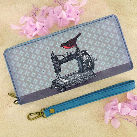 Mlavi studio's cool retro sewing machine & scissor print vegan large wristlet wallet made with SGS tested cruelty-free Eco-friendly cruelty free vegan materials. Wholesale available at www.mlavi.com for gift shop, fashion accessories & clothing boutique in Canada, USA & worldwide.
