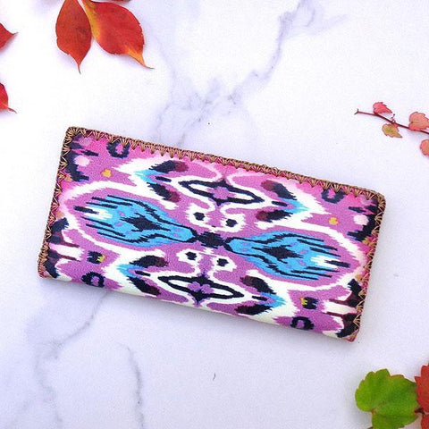 Mlavi large vegan flat wallet with whimsical & exotic Ikat pattern print & framed with decorative stitches around the edge made with cruelty-free Eco-friendly faux/vegan materials. This bohemian chic vegan wallet is fun & functional for everyday use or as gift for your family & friends who appreciate fashion accessories that makes bold statement especially for those who embrace vegan life style. 