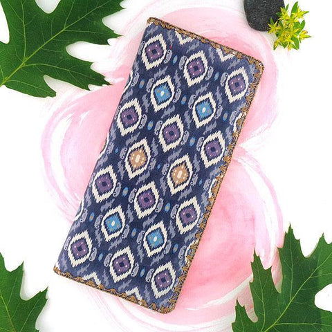 Mlavi large vegan flat wallet with whimsical & exotic Ikat pattern print & framed with decorative stitches around the edge made with cruelty-free Eco-friendly faux/vegan materials. This bohemian chic vegan wallet is fun & functional for everyday use or as gift for your family & friends who appreciate fashion accessories that makes bold statement especially for those who embrace vegan life style. 
