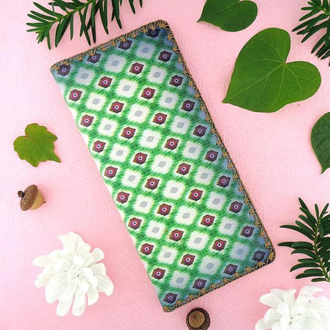 Mlavi large vegan flat wallet with whimsical & exotic Ikat pattern print & framed with decorative stitches around the edge made with cruelty-free Eco-friendly faux/vegan materials. This bohemian chic vegan wallet is fun & functional for everyday use or as gift for your family & friends who appreciate fashion accessories that makes bold statement especially for those who embrace vegan life style. 