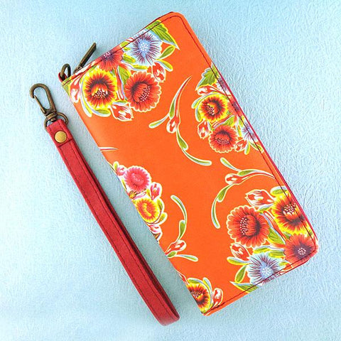 Mexican oilcloth style bloom flower print orange vegan wristlet wallet for every use, travel or as gift for family & friends. Wholesale at www.mlavi.com