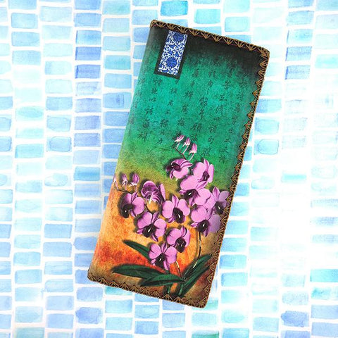 Mlavi studio orchid flower print vegan large flat wallet made with Eco-friendly & cruelty free vegan materials. Great for everyday use or as gift for family & friends. Wholesale at www.mlavi.com to gift shop, clothing & fashion accessories boutiques, book stores in Canada, USA & worldwide.