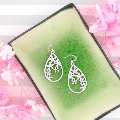 Shop LAVISHY's lilac flower cutout earrings