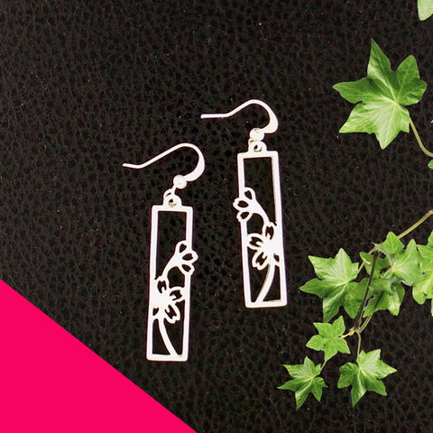 Online shopping for LAVISHY silver plated cutout cherry blossom flower pendant earrings. Wholesale available at www.lavishy.com to gift shops, fashion accessories and clothing boutiques in Canada, USA and worldwide.